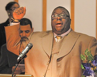 The Rev. Dr. Lewis W. Macklin II leads the congregation in worship during the annual Emancipation Proclamation and Installation Service, which was Tuesday at Tabernacle Baptist Church in Youngstown. State Sen. Nina Turner of Cleveland was the main speaker.