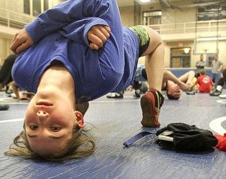 William D Lewis the Vindicator Hubbard sophomre wrestler Shirley Flynn warms up before a recent practice. She is one of just a few girl wrestlers in the state.