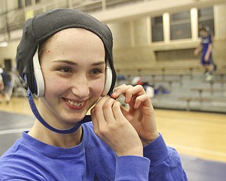 William D Lewis the Vindicator Hubbard sophomore wrestler Shirley Flynn warms up before a recent practice. She is one of just a few girl wrestlers in the state.