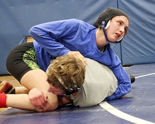 William D Lewis the Vindicator Hubbard sophomore wrestler Shirley Flynn wrestles C.J. Latronico, a Hubbard freshman in the 106 pound class during a recent practice. She is one of just a few girl wrestlers in the state.
