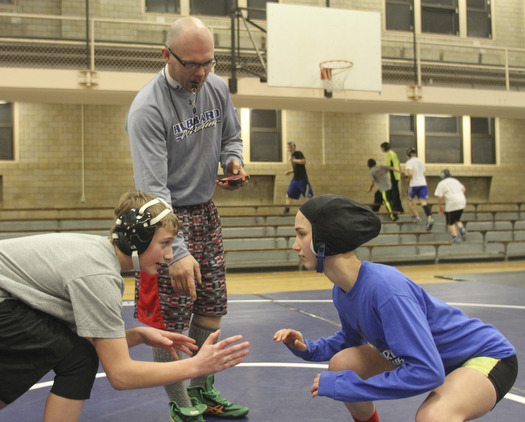 William D Lewis the Vindicator Hubbard sophomore wrestler Shirley Flynn prepares to wrestle C.J. Latronico, a Hubbard freshman in the 106 pound class during a recent practice. Coach Don Newell Jr. is in background. She is one of just a few girl wrestlers in the state.