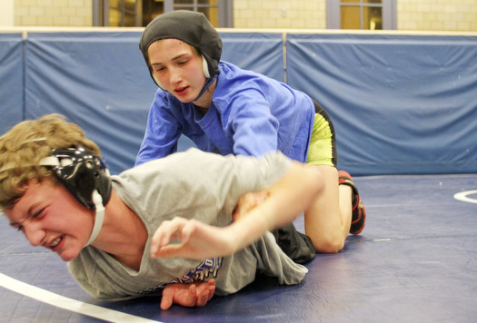 William D Lewis the Vindicator Hubbard sophomore wrestler Shirley Flynn  wrestles C.J. Latronico, a Hubbard freshman in the 106 pound class during a recent practice.  She is one of just a few girl wrestlers in the state.