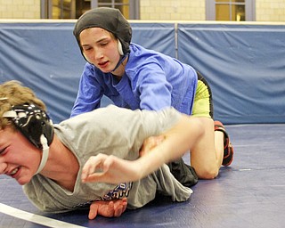 William D Lewis the Vindicator Hubbard sophomore wrestler Shirley Flynn wrestles C.J. Latronico, a Hubbard freshman in the 106 pound class during a recent practice. She is one of just a few girl wrestlers in the state.