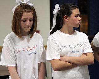 William D. Lewis the Vindicator Wilmingotn HS cheerleaders Jenna Gates, left, and Alyssa Davis wear shirts remembering classmate who was killed in traffic accident.