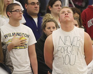 William D. Lewis the Vindicator Somber faced students at Wilmingotn HS wear white in honor of classmate killed in traffic accident.