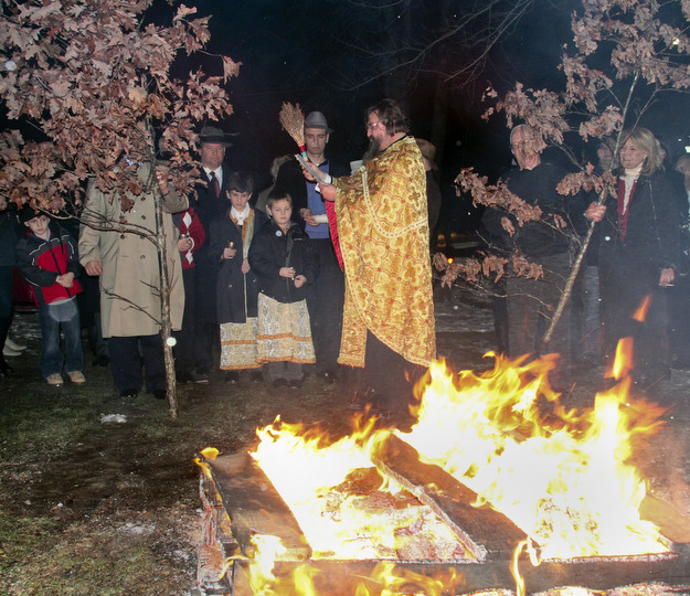 William D Leewis The Vindicator  Rev Milan Medakovic conducts blessing during Christmas eve service Sunday 1-7-12 at Holy Trinity Serbian Orthodox Church in Youngstown. The yule logs were then placed on hte fire outside the church.