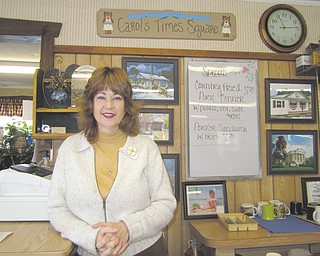Carol Wilson, one of the owners of the Times Square Restaurant in Kinsman, stands inside the restaurant. She and her husband are hoping to convince the Ohio Environmental Protection Agency to back off on a demand for payment of a $70,000 fine for the environmental damage the EPA says their former septic system caused during the first two years Wilson and her husband operated the restaurant.