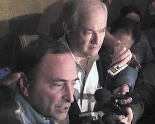 In this image from video, NHL commissioner Gary Bettman, left, talks to the media as Donald Fehr, executive director of the NHL Players’ Association, stands next to him, in New York, early Sunday.