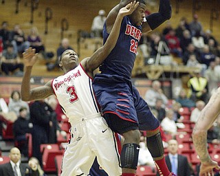 William D Lewis the Vindicator Detroits Doug Anderson (23) pulls down a rebound past YSU's Kendrick Perry(3) during 1rst half action Thursday 1-9-13 at YSU.