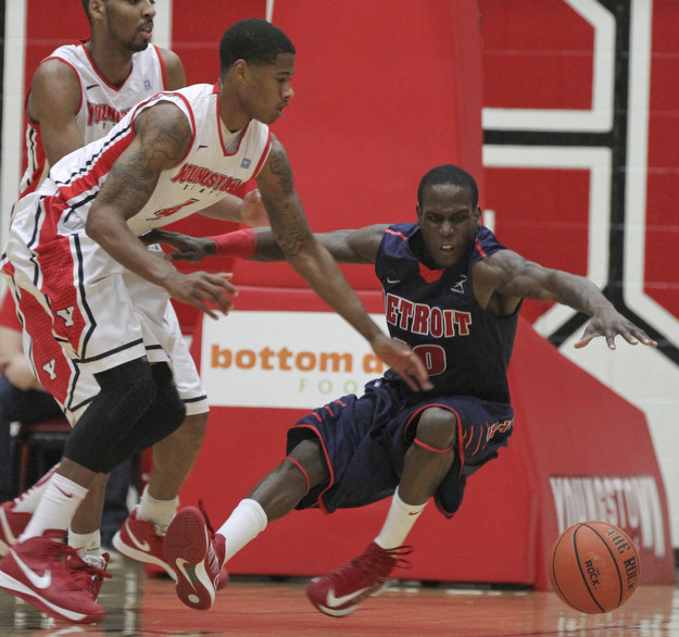 William D Lewis the Vindicator  YSU's Shawn Amiker(4) and Detroit's Jason Calliste(10) during 1rst half action Thursday 1-9-13 at YSU.