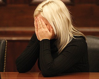 Michele Green, 22, of Youngstown sobs as she listens to a victim-impact statement in common pleas court. She pleaded guilty to attempted aggravated vehicular homicide.