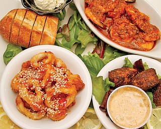 Sample of several small seafood appetizers at Steamers Tavern