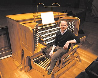 Colin Lynch sits at the console of the pipe organ at Stambaugh Auditorium. Lynch, of Boston, came to
Youngstown this week to record an album on the organ.