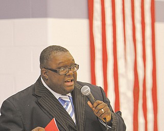 The Rev. Lewis Macklin talks about civil-rights leaders Dr. Martin Luther King Jr. and Rosa Parks and the second inauguration of President of Barack Obama during a Martin Luther King Jr. program Wednesday at Williamson Elementary School in Youngstown.