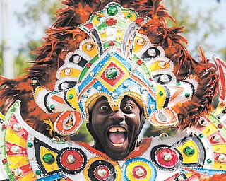 A carnival dancer performs at the annual Martin Luther King Jr. Day parade in Miami on Monday. Events honoring the slain civil-rights leader took place across the country.