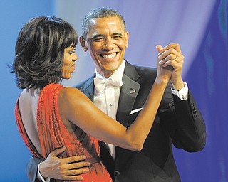 President Barack Obama dances with first lady Michelle Obama during The Inaugural Ball at the Washington Convention Center during the 57th Presidential Inauguration festivities in Washington on Monday.