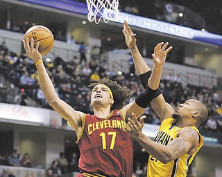 The Cleveland Cavaliers’ Anderson Varejao (17) puts up a shot against the Indiana Pacers’ David West during the first half of a game in Indianapolis. Varejao will miss the rest of the season after a blood clot was found in his right lung.