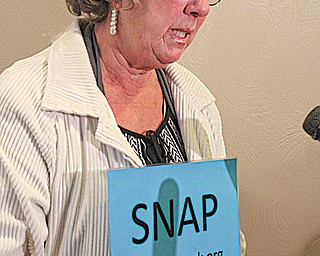 Judy Jones member of SNAP, Survivors Network of those Abused by Priests, speaks outside the Mahoning
County prosecutor’s office Tuesday. Jones said SNAP has gotten new reports of sex abuse in the Youngstown
Diocese.