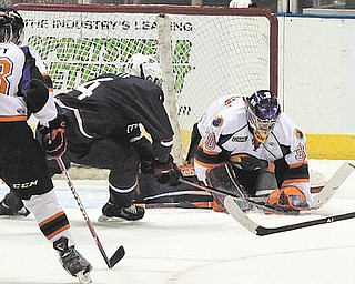 Phantoms goaltender Sean Romeo stops a shot by Team USA’s Tyler Motte during a Dec. 21 game at the Covelli Centre. Romeo’s two game suspension is over and he’ll be in goal on Friday against the Indiana Ice.