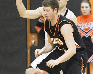 William d Lewis the Vindicatore Springfield's Jared McTigue(32) drives around Ridge's Nate Palmer(23) during 1 rst half action Tuesday at Ridge.