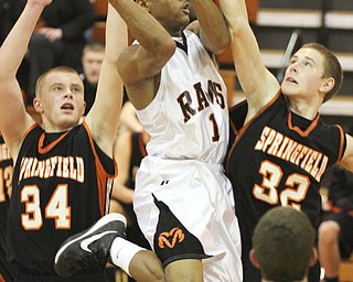 William d Lewis the Vindicatore Springfield's Jared McTigue(32) tries to block Ridge's Nate PalmerCorby Phillips(1) during 1 rst half action Tuesday at Ridge.