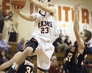 William d Lewis the vindicator Ridge's Nate Palmer(23) goes for 2 past Springfield's Jared McTigue(32).