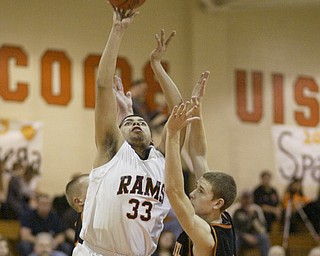 William d Lewis the vindicator Ridges Brandon Perkins(33) goes for 2 past Springfield's Jared McTigue(32).