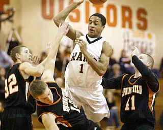 William d Lewis The Vindicator Ridge's Corby Phillips(1) collides with Springfield's Mark Schuler(12) during 1rst half action Tuesday at Ridge. Schuler was charged with the foul.