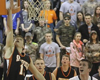 William d Lewis the Vindicator Springfield's Eoghan Bees (13) puts up a basket during 1 rst half action Tuesday at Ridge.
