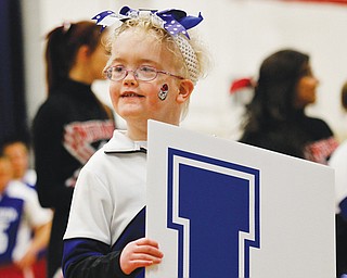 The Fairhaven School student body, along with staff and parents cheered as the school’s Bulldogs mixed it up on the basketball court Wednesday with athletes from Girard High School during the second annual Winter Classic exhibition basketball game. Participating from Fairhaven, include cheerleader Erin Pessell.