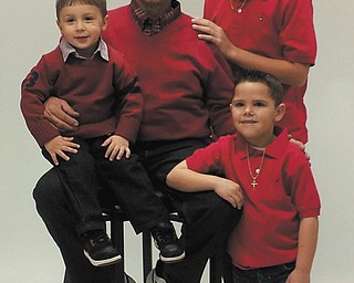 Christopher, Dominic, Tom and Santino, dressed in red.