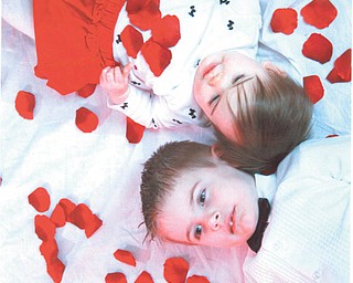 Which way is up? It doesn't matter when both ways are cute! Here are Carson (4) and Clara (1 1/2) Evrard, children of Chris and Jacque Evrard of Enon, Ohio. The photo, taken by the kids' father, was sent in by Joanie Ready of Columbiana, the kids' grandmother.