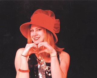 Youngstown State University student Leanna Hartsough models a red-hot hat. Photo by Lana VanAuker of Canfield, Leanna's grandma.