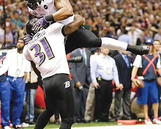 Baltimore Ravens linebacker Ray Lewis (52) and safety Bernard Pollard (31) celebrate an incomplete pass thrown by San Francisco 49ers quarterback Colin Kaepernick late in Sunday’s Super Bowl.