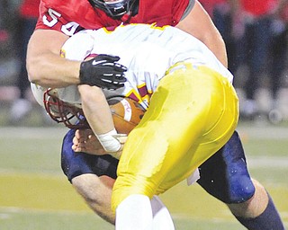 Fitch defensive end Billy Price (54) sacks Cardinal Mooney quarterback Jon Saadey (16) during the Falcons’ 49-7 victory on Oct. 26, 2012, at Fitch Falcon Stadium. Price signed with Ohio State on Wednesday.