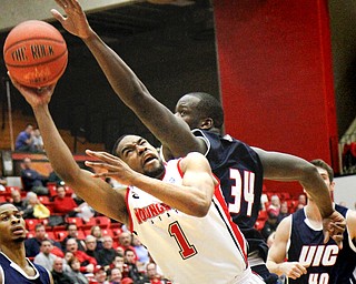 MADELYN P. HASTINGS | THE VINDICATOR
Youngstown State's Blake Allen (1) takes a shot for the team while UIC's Josh Crittle (34) tries to block his shot during the second half of their game at the Beeghly Center on February 10, 2013. The Flames beat the Penguins 88-83 in triple overtime.