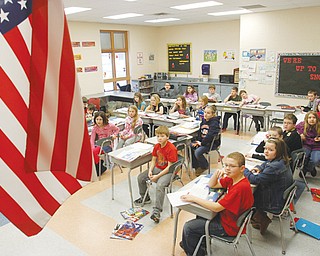 Students in Matt Vukovic’s class at Roosevelt Elementary in McDonald listen to a science lesson. The U.S. Department of Education has selected Roosevelt to represent Ohio and the nation’s fourth-graders on the National Assessment of Educational Progress. The test will be given to them Tuesday.