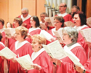 St. Christine’s Church adult choir and choral group led by Ron Goulish practice. The group is participating in the third annual choral festival sponsored by the Mahoning Valley Association of Churches. Also participating for the first time at the event will be members of the American Guild of Organists. The festival will take place at 6 p.m.
Sunday at St. Christine Church in Youngstown. The ecumenical event provides an opportunity for people from different faith traditions to enjoy various styles of worship.