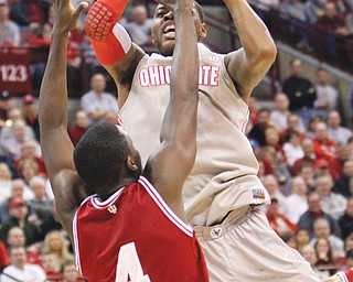 Ohio State’s Deshaun Thomas shoots over Indiana’s Victor Oladipo during the first half of their Big 10 Conference basketball game Sunday in Columbus. Both Oladipo and Thomas put up 26 points — a career best for Oladipo — but the No. 1 Hoosiers bounced the No. 10 Buckeyes, 81-68.