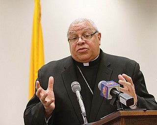 Bishop George V. Murry of the Diocese of Youngstown addresses a news conference Monday afternoon about
the resignation of Pope Benedict XVI. The bishop also presented ideas on qualities that the next leader of the
world’s 1 billion Catholics should possess.