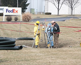 Workers prepare to go inside a storm sewer system after gaining better access to clean drainage in the aftermath of last month’s oil and brine dumping at 2761 Salt Springs Road.