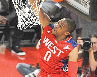 West Team’s Russell Westbrook of the Oklahoma City Thunder makes a layup against the East Team during the 
first half of the NBA All-Star game Sunday in Houston.