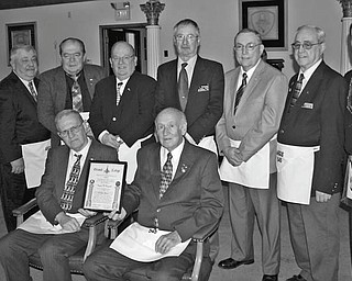 SPECIAL TO THE VINDICATOR
Argus Masonic Lodge 545 in Canfield recently paid tribute to 14 of its longtime members. Some of the lodge members are, from left standing, Allan G. Bohr, Ross D. Lucarell, John J. Koscelansky, Jerome A. Kovach, Richard A. Meshula, Paul Hershey, Ralph A. Ruggiero and Russell W. Gillam Jr.; and seated are Eugene W. Raupach and Glenn J. Ringer.