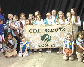 SPECIAL TO THE VINDICATOR
In honor of the first National Girl Scout Cookie Day Feb. 8, Harlem Globetrotters female star Fatima “TNT” Maddox is pictured with Girl Scout Troop 80691 of New Middletown. Maddox joined the Globetrotters last year to become the first female player in almost 20 years. Maddox met the Girl Scout Troop at a private meet and greet before the recent Globetrotters game at the Covelli Centre in Youngstown. In honor of the Cookie Day, Maddox and teammates, Tammy “T-Time” Maddox and Ariel “Mighty” Mitchell joined forces with their local hometown Girl Scout councils and registered as adult Girl Scouts of the U.S.