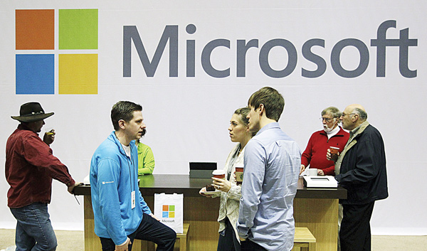 Microsoft Corp. retail store employees and guests mingle at a pop-up Microsoft Store during Microsoft’s annual meeting of shareholders in Bellevue, Wash. Longtime users of Hotmail, MSN and other Microsoft email services will start noticing a big change: When they sign in to check messages, they’ll be sent to a new service called
Outlook.com.