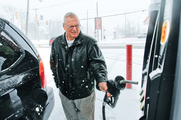 Ron Catale of Poland fills up at Big Apple Supermarket at Albert Street and McGuffey Road on Youngstown’s East Side, which had gas 12 cents lower than the Northeast Ohio average of $3.81 per gallon. Catale is among many Mahoning Valley residents feeling a pinch at the pump. According to AAA, gas prices have jumped nearly 45 cents in the past month.