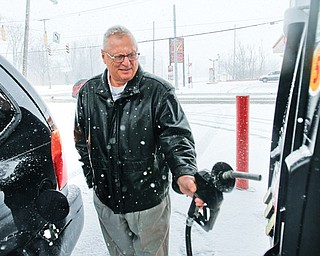 Ron Catale of Poland fills up at Big Apple Supermarket at Albert Street and McGuffey Road on Youngstown’s East Side, which had gas 12 cents lower than the Northeast Ohio average of $3.81 per gallon. Catale is among many Mahoning Valley residents feeling a pinch at the pump. According to AAA, gas prices have jumped nearly 45 cents in the past month.