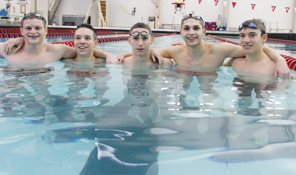Canfield swimmers, from left, Connor Brady, Mike Cardone, Nicky Montalto, Daniel Bogen and Michael DiDomenico pause for a moment during practice at the Youngstown State University pool. The five enter this weekend’s state swimming meet with a hopes of top-five finishes.