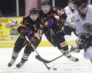 William D Lewis The Vindicator Phantoms Zach Evancho(16) and Kyle Connor(18) move the puck during 2-23-13 game with Lumberjacks.