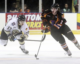 William D Lewis The Vindicator Phantoms Eric Sweetman(2) moves the puck past Lumberjack's Frederick Tiffeis (17during 2-23-13 game with Lumberjacks.